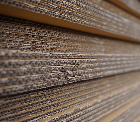 Using borates for quicker tack in corrugated cardboard
