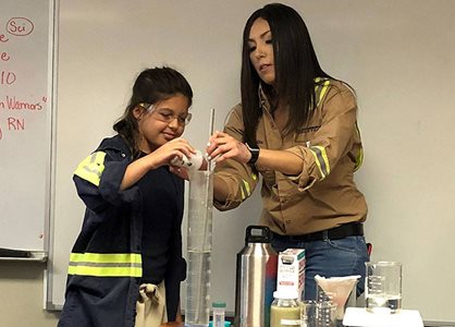 U.S. Borax employee conducting experiment in science class
